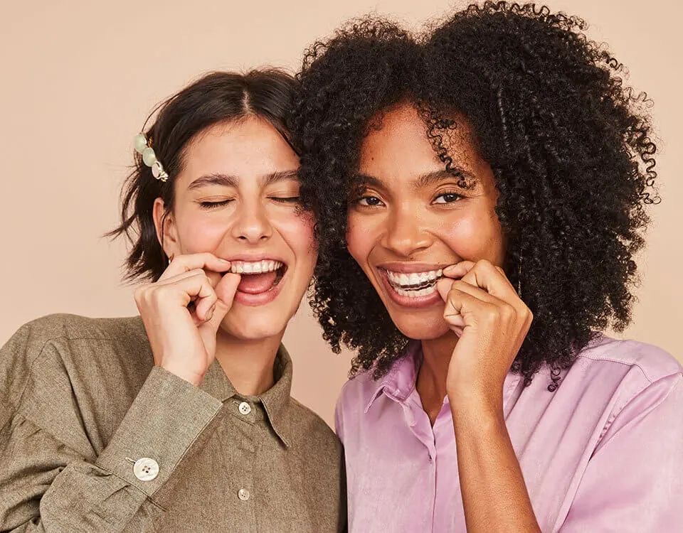Teenagers with Invisalign Teen aligners