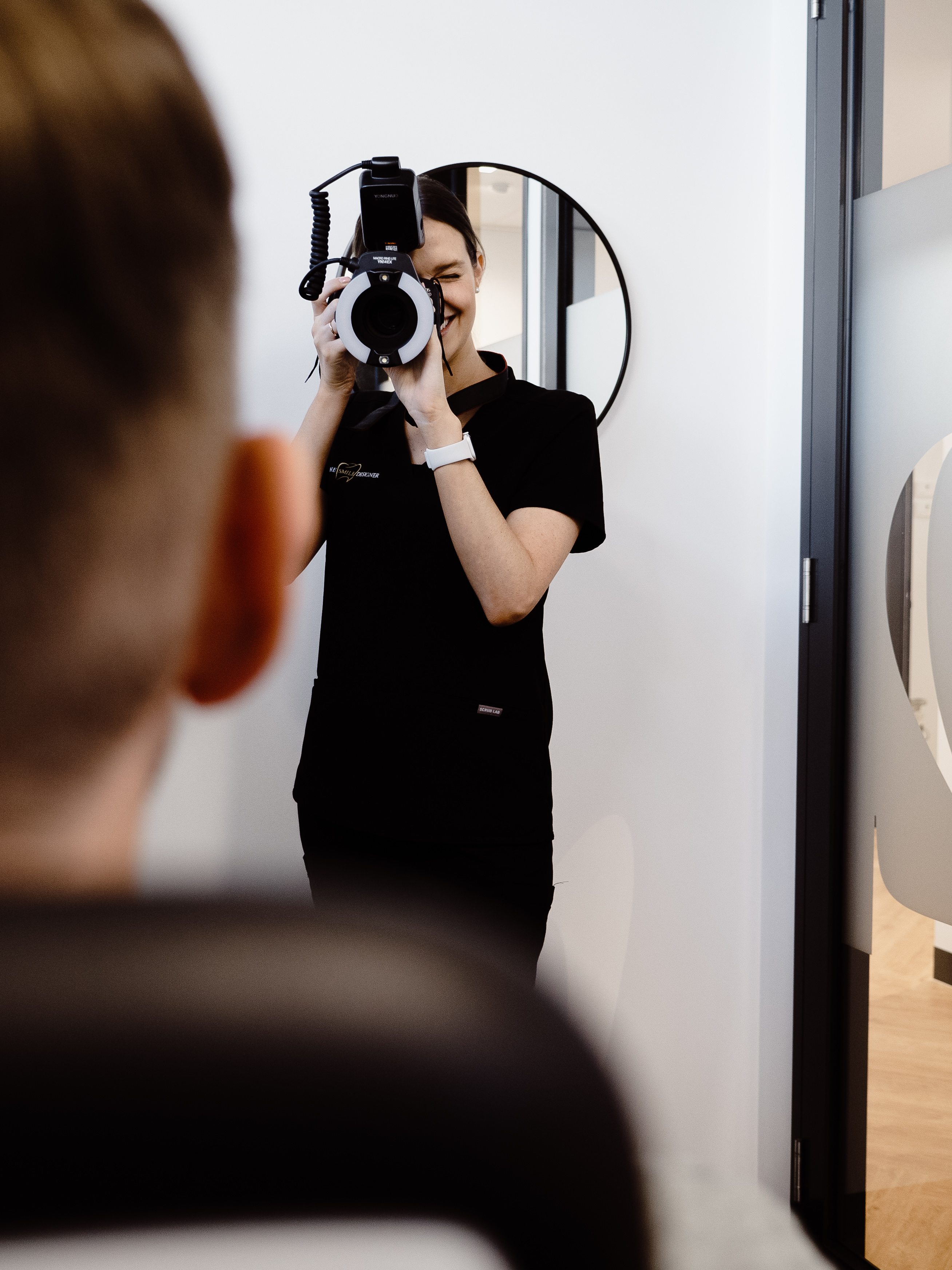 The Smile Designer clinician capturing clinical photography for Digital Smile Design